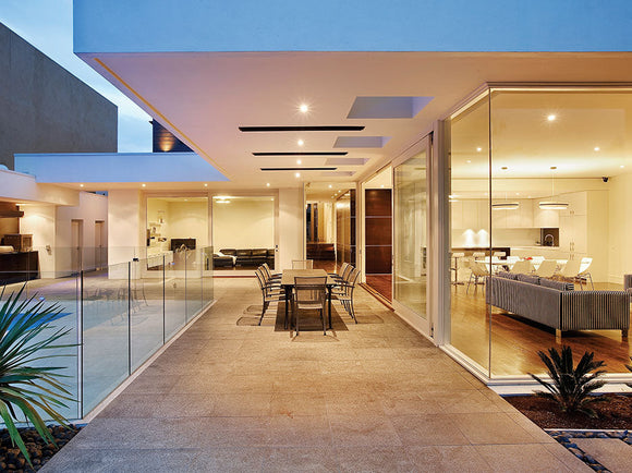 Sleek Heatstrip Classic heater above a patio dining table, providing cozy alfresco warmth